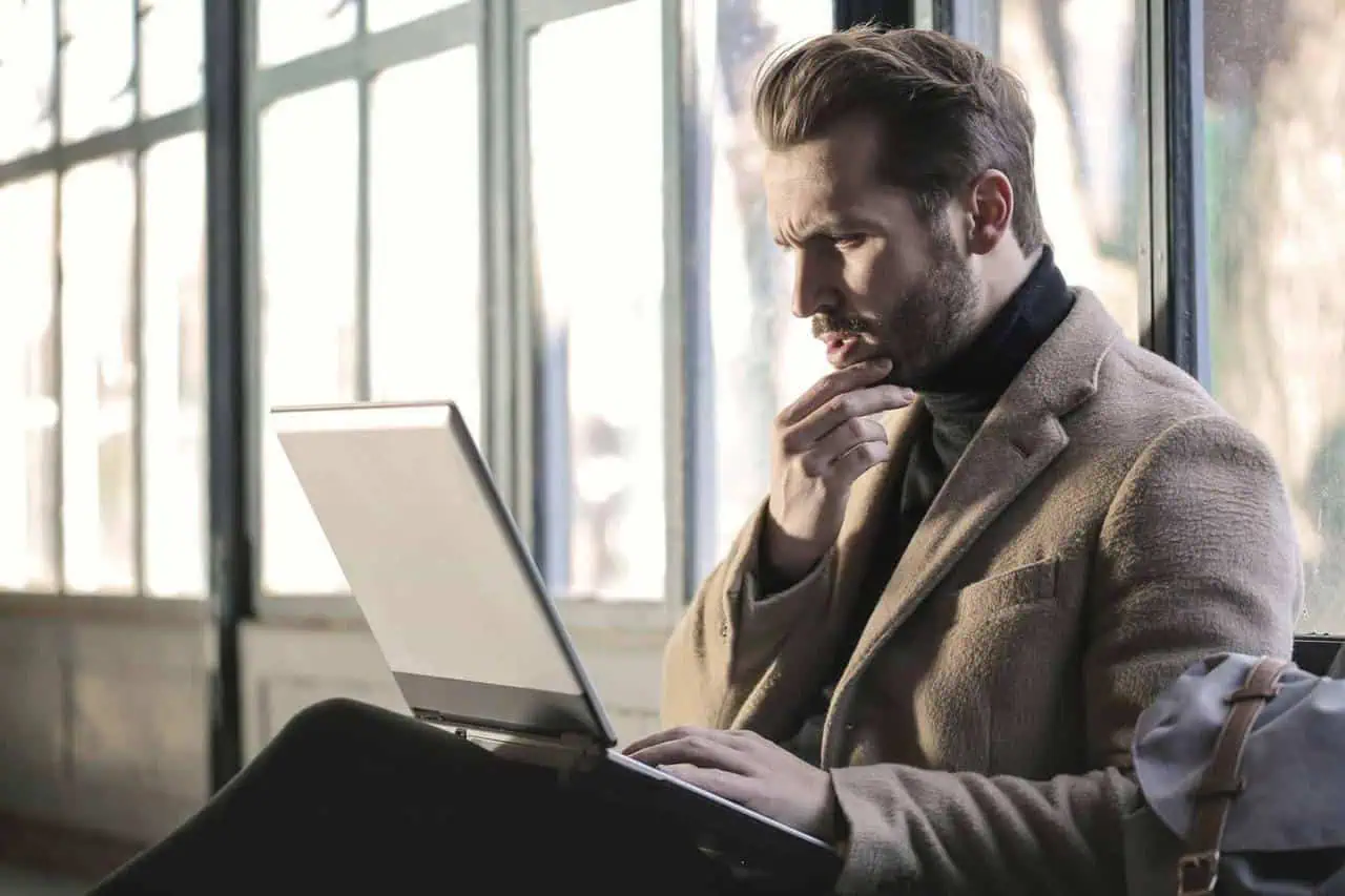 Focused professional working on a laptop—ideal image for executive resume services, leadership CV writing, and career transition support.