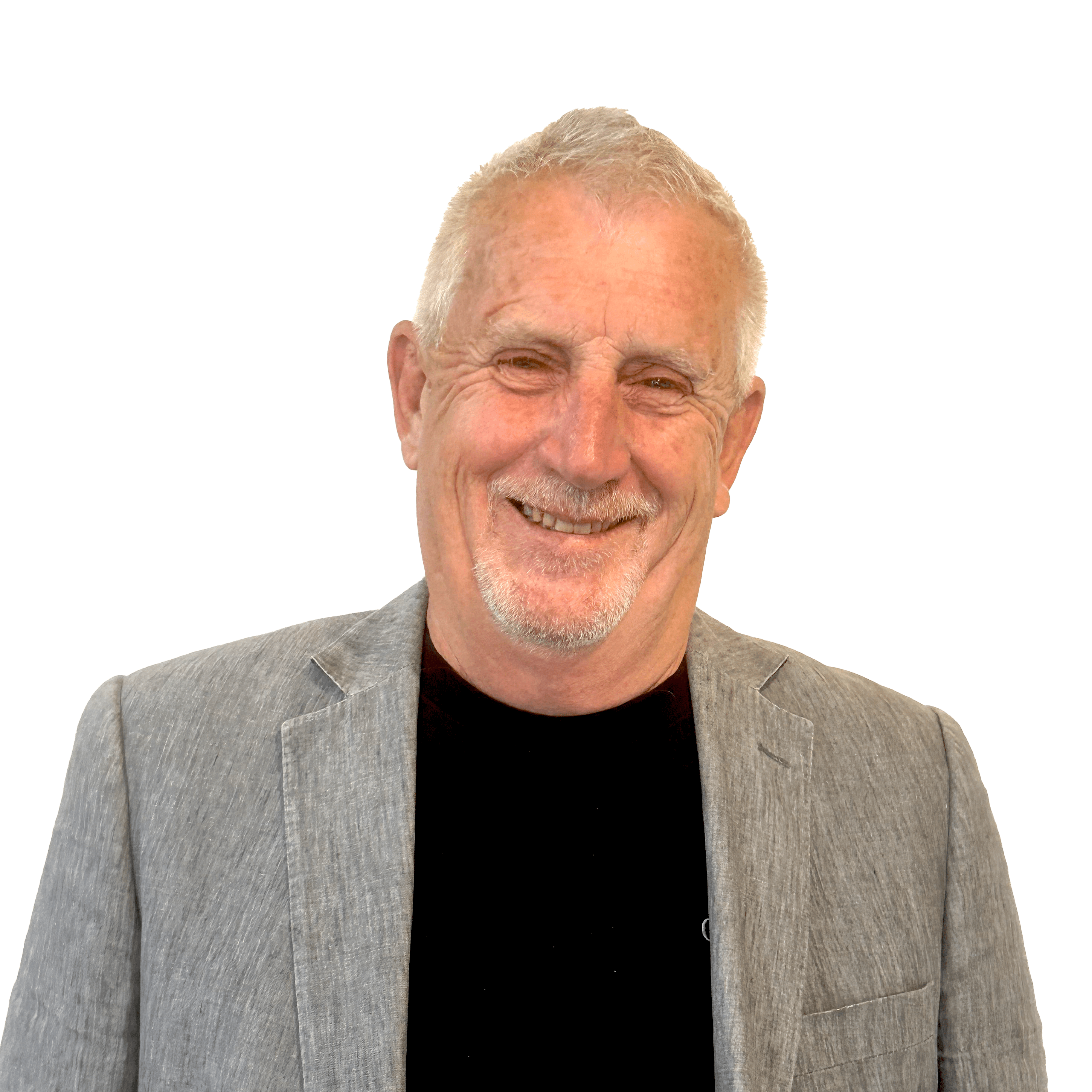 Portrait of David Jordan, CV Editor and Writer for the New Zealand Support Desk, smiling in a light gray blazer and black shirt. professional CV services 