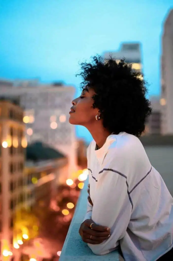 African student gazing over a city skyline at dusk, symbolizing career growth and career opportunities in Africa for students and graduates