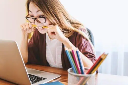 Young woman contemplating life skills like communication, budgeting, networking, time management, and problem-solving