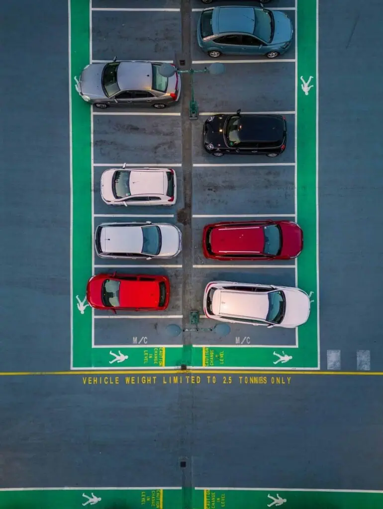 Overhead view of a parking lot with cars – highlighting career paths in fleet maintenance, vehicle logistics, and transport operations management