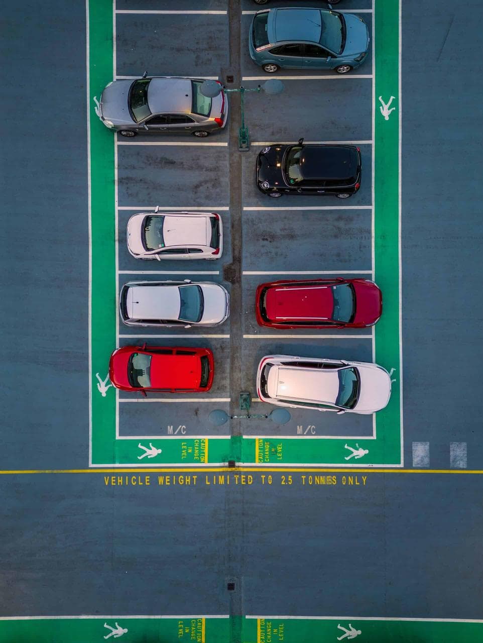 Overhead view of a parking lot with cars – highlighting career paths in fleet maintenance, vehicle logistics, and transport operations management