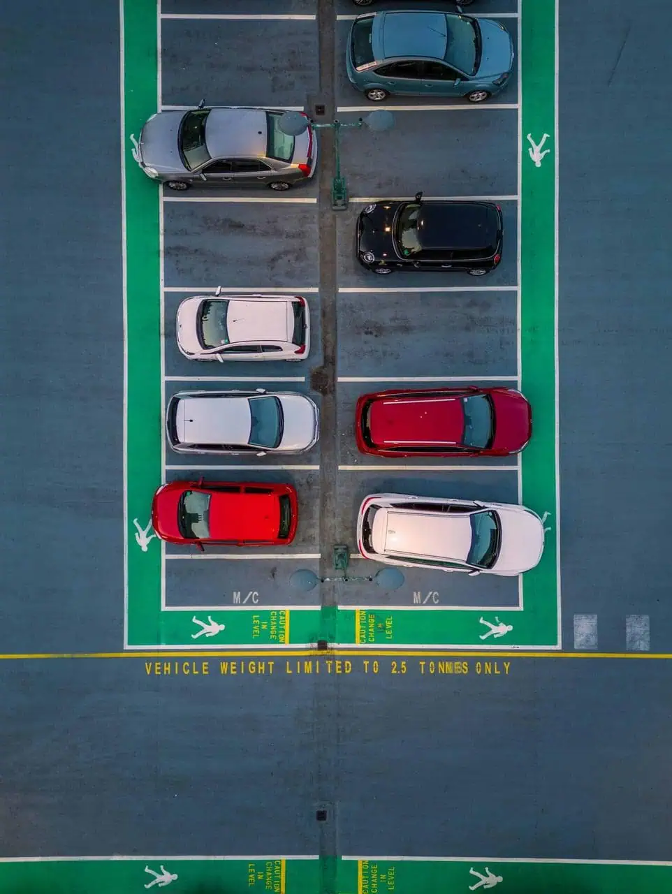 Overhead view of a parking lot with cars – highlighting career paths in fleet maintenance, vehicle logistics, and transport operations management