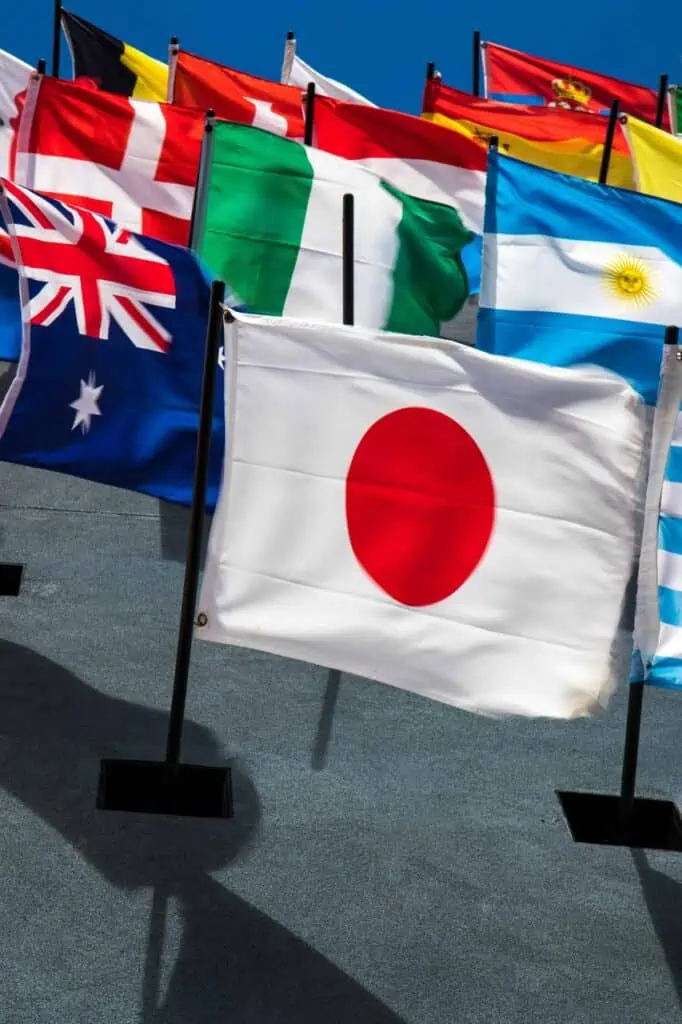 International flags waving in the wind, representing global opportunities, cultural diversity, and international career growth.