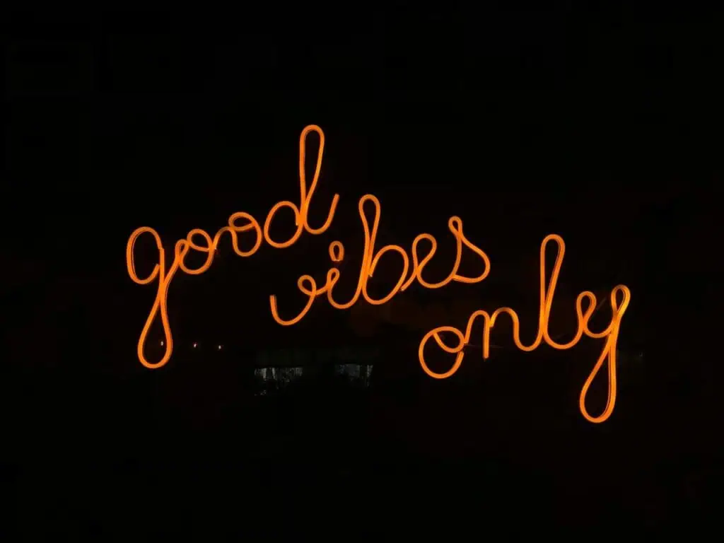 Neon sign glowing in orange with the words 'Good Vibes Only', symbolizing positivity and career confidence. CV Testimonials