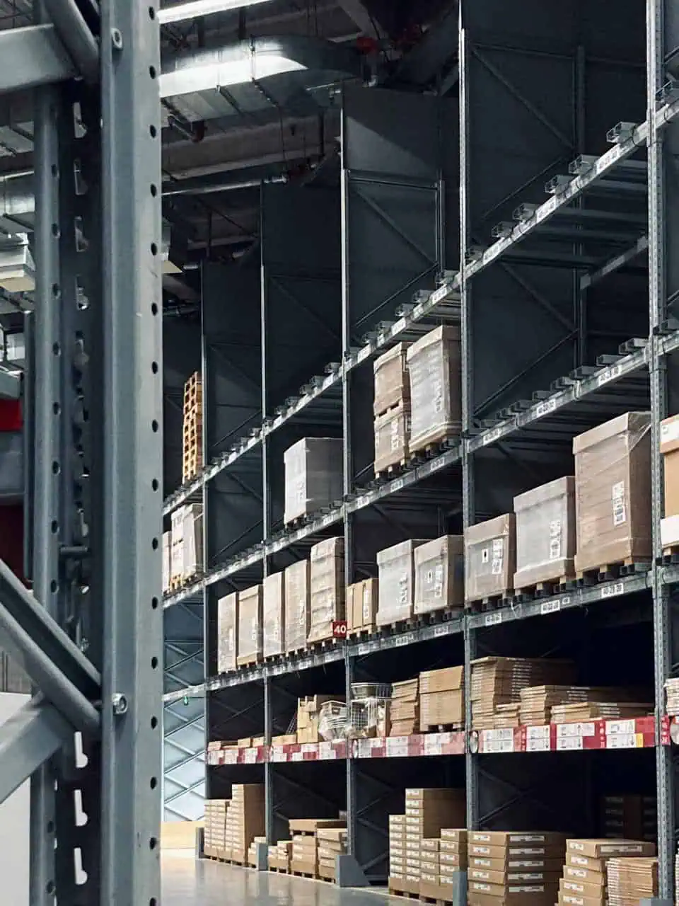 Warehouse racks loaded with pallets and boxes organized for shipping and receiving operations