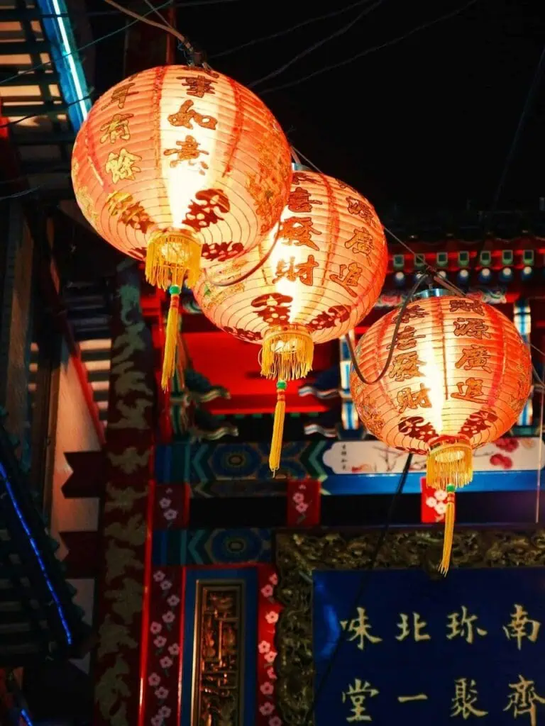 A student in China experiencing the beauty of traditional Chinese lanterns during a cultural festival.