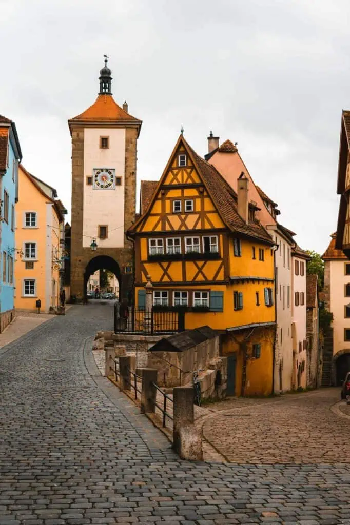 A picturesque street in Rothenburg ob der Tauber, Germany, showcasing medieval architecture and cultural heritage
