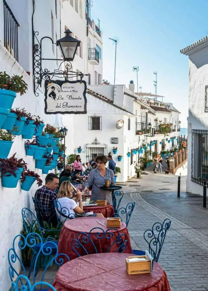 Outdoor café in a charming Spanish village, offering students a taste of local culture and cuisine.