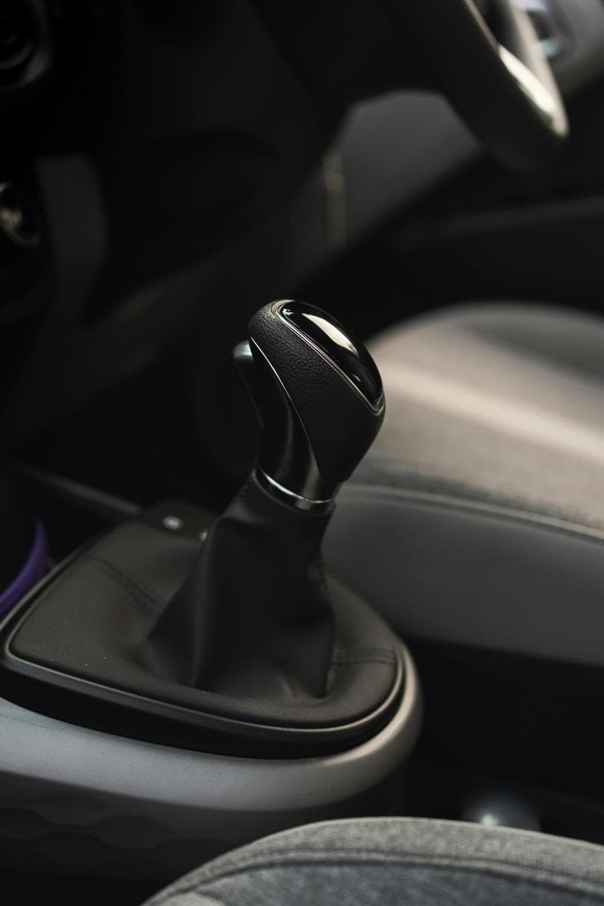 Close-up of automatic gear shift inside modern vehicle interior