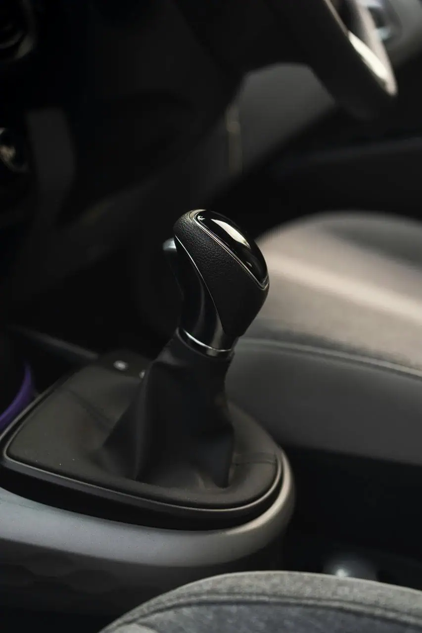 Close-up of automatic gear shift inside modern vehicle interior