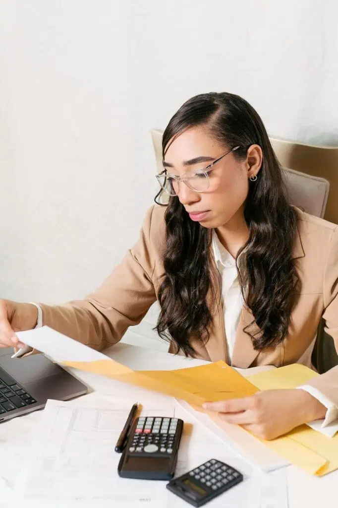 Certified public accountant reviewing financial statements at desk