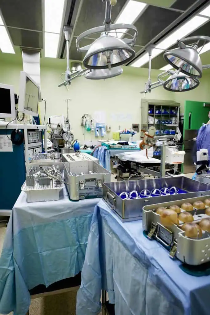 Hospital procurement specialist managing surgical supplies and medical equipment in operating room