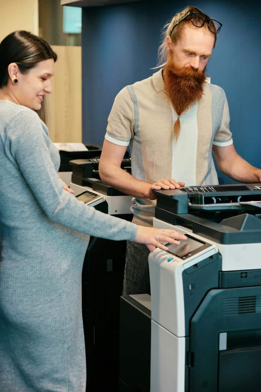 Printer consultant showing multifunction copier features to customer