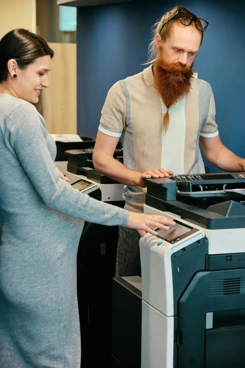 Printer consultant showing multifunction copier features to customer